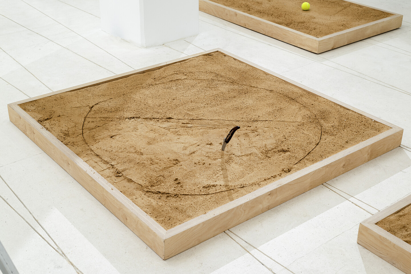 Pinch, 2024, Stainless steel and wooden knife, sand, wood, 150 &times; 150 &times; 10 cm