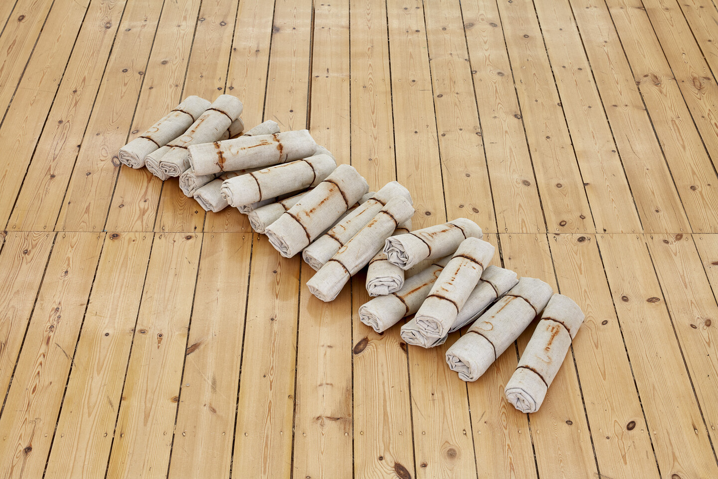 Untitled, 1997, Marks of rusty keys on rolled canvases, 20 elements